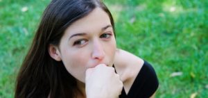 woman thinking on grass