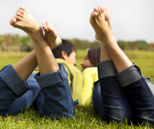 image of a couple on the grass talking