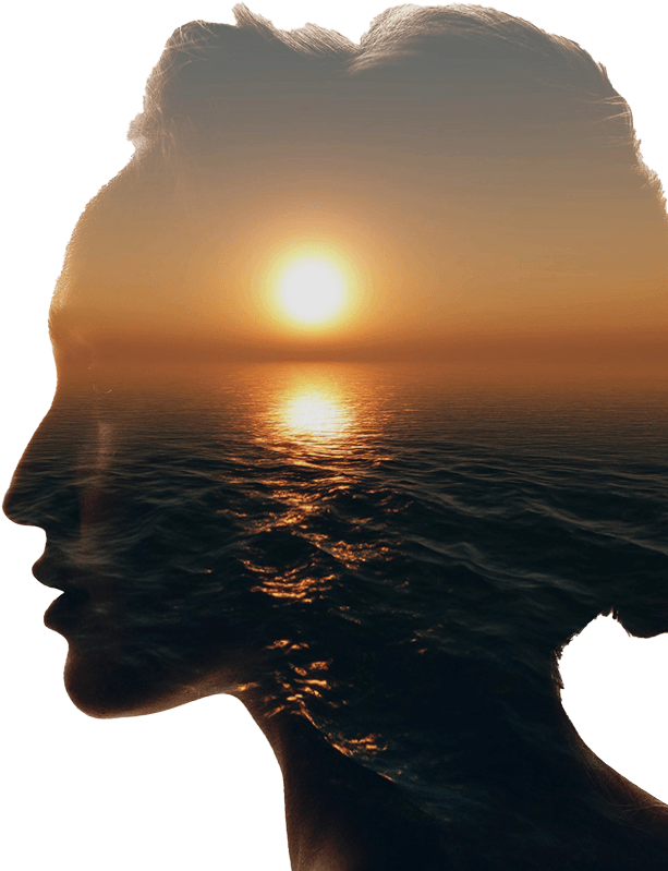 Double exposure of a woman's side profile combined with an ocean sunset, blending her silhouette with the water and sun on the horizon.