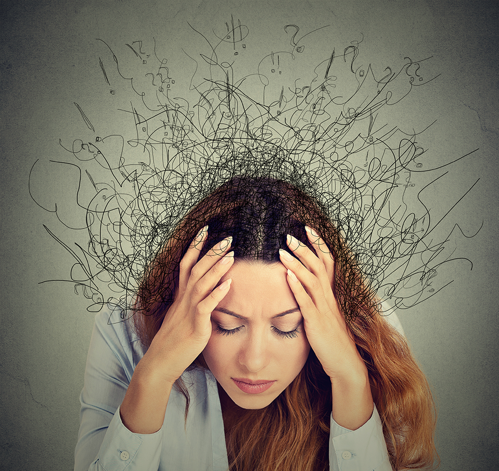 Closeup sad young woman with worried stressed face expression and brain melting into lines question marks. Obsessive compulsive, adhd, anxiety disorders