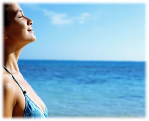 image of woman breathing at the ocean