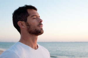 man sitting meditating