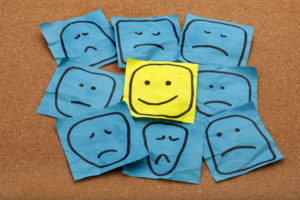 post it notes with drawings of happy, sad or other emotions