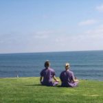 image of Dr Hilary and Dr Kim meditating in front of ocean at Sanoviv Medical Institute