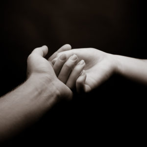 image of two hands touching