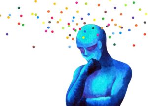 The Difference between Brainspotting and traditional therapy approaches Blue, abstract human figure in a thinking pose with colorful dots floating above its head on a white background.